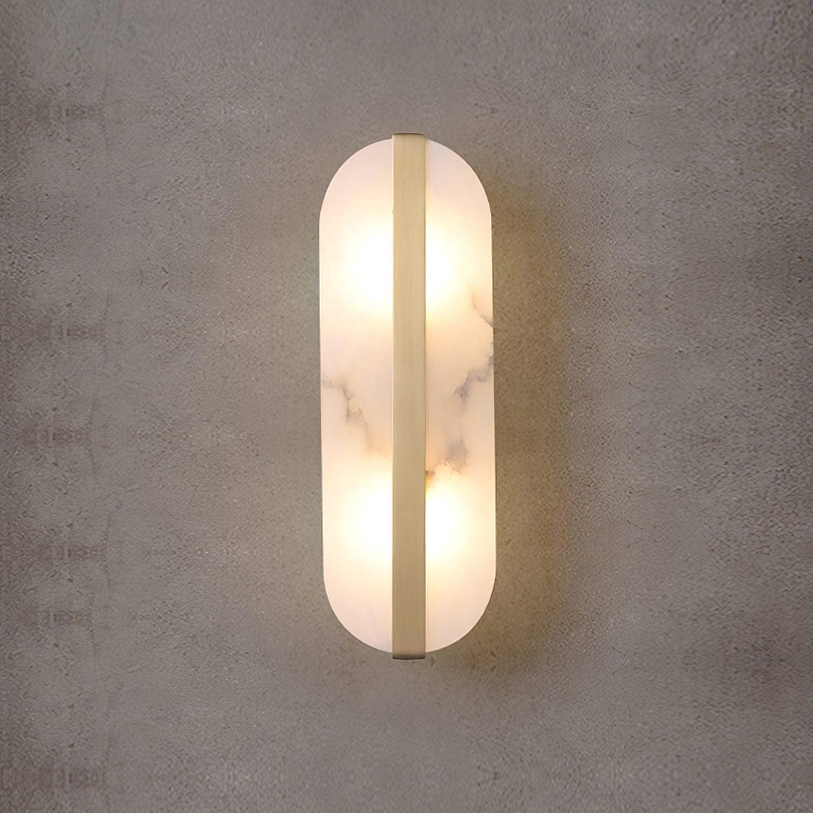 White veined sconce illuminated on a textured wall