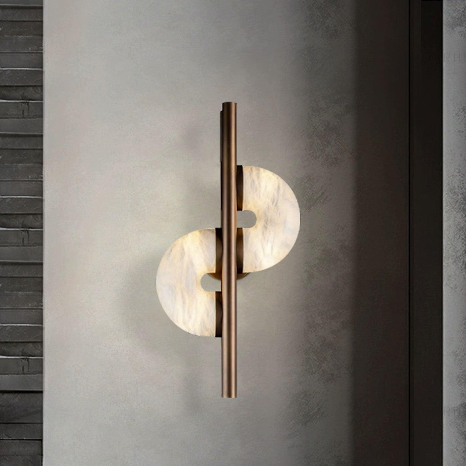 Glowing staggered stone discs on grey wall between dark horizontal brick at left and a vertical dark panel at right