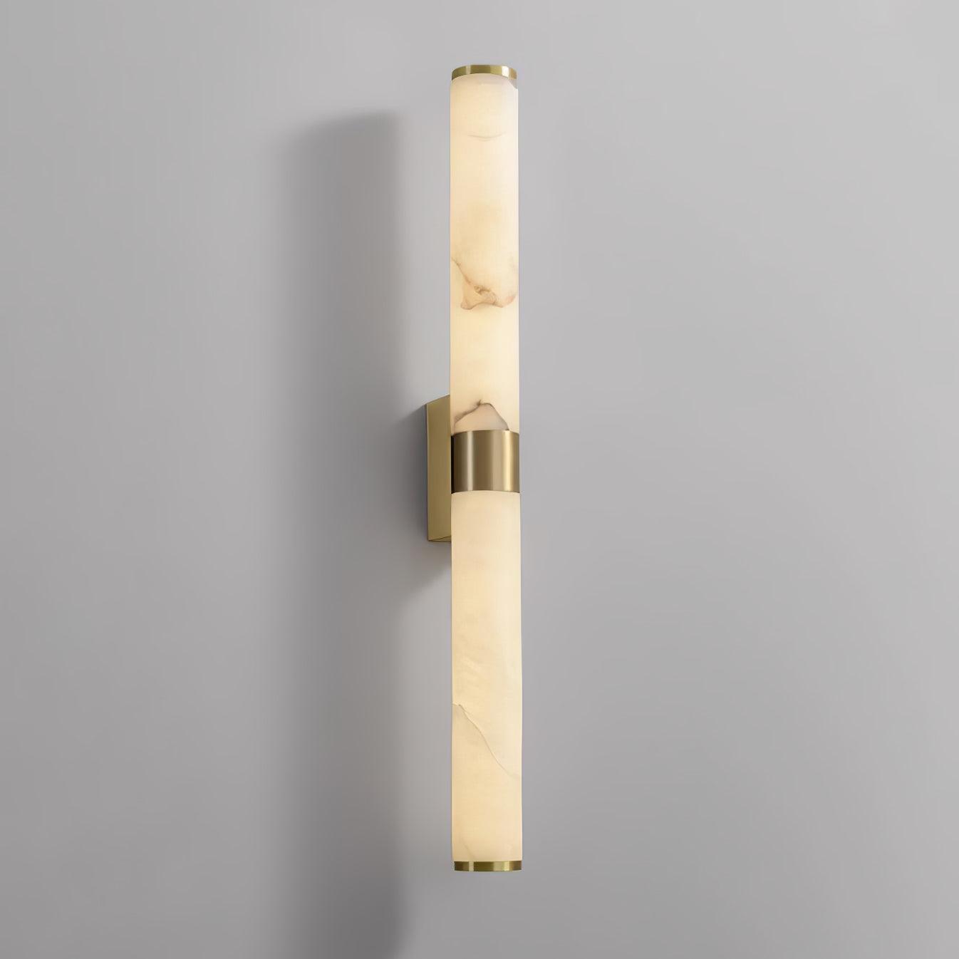 Vertical stone tube light with projecting brass wall mount