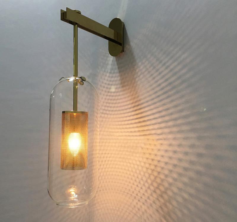 Warm reflections behind a clear glass wall shade
