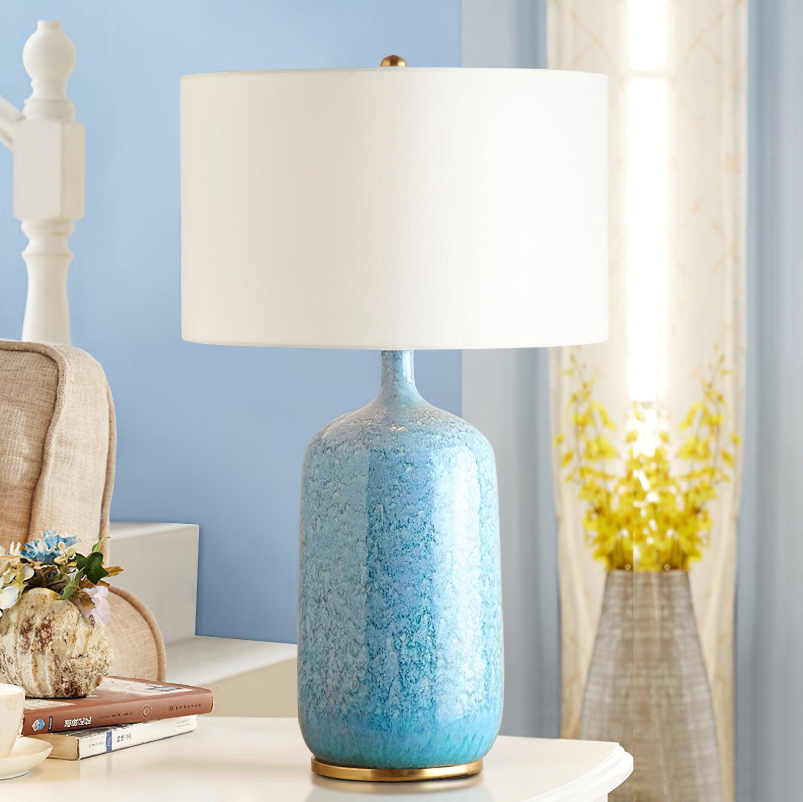Culloden blue ceramic lamp on a dresser near a mirror