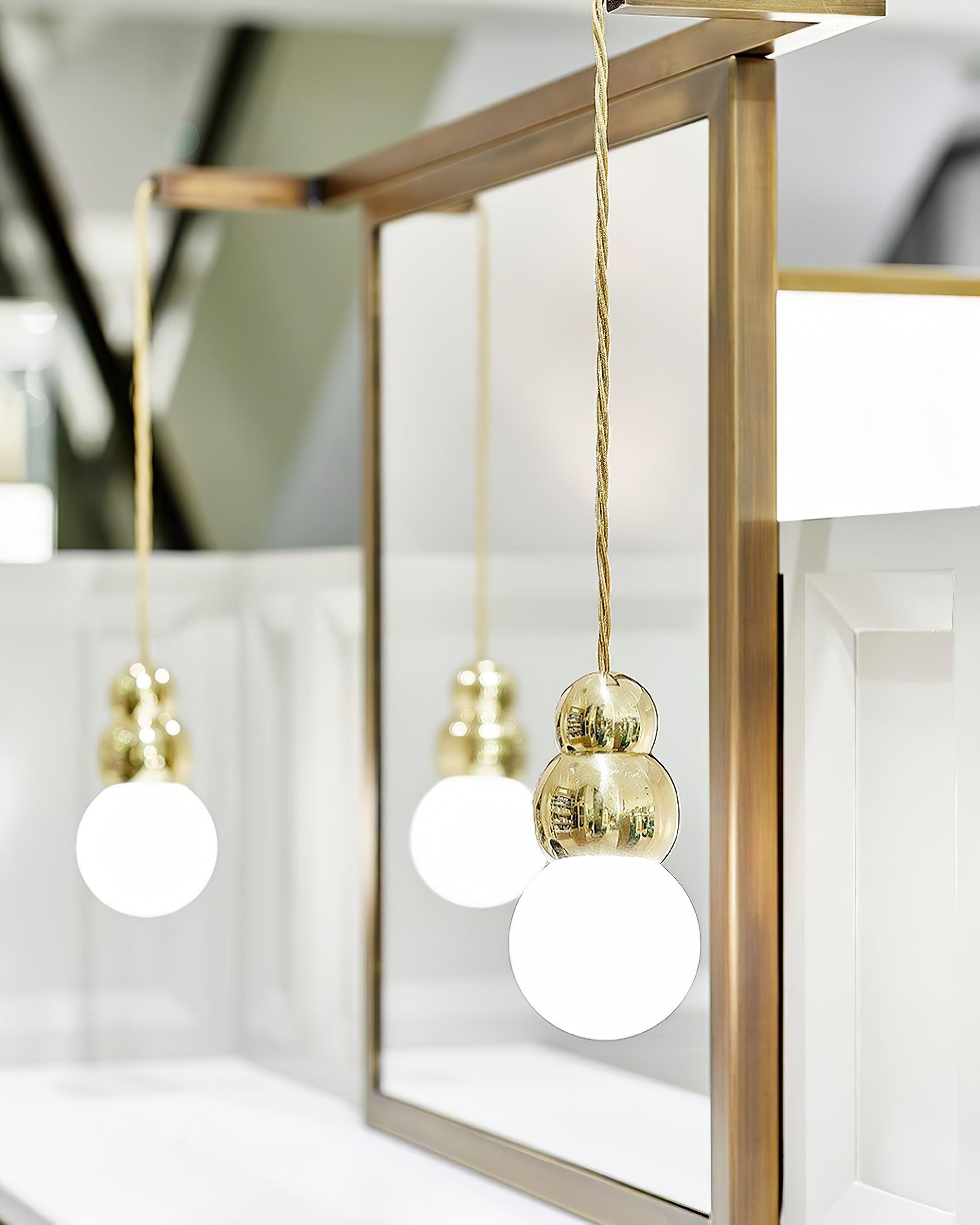 Gold spherical light bodies and White globes by a mirror