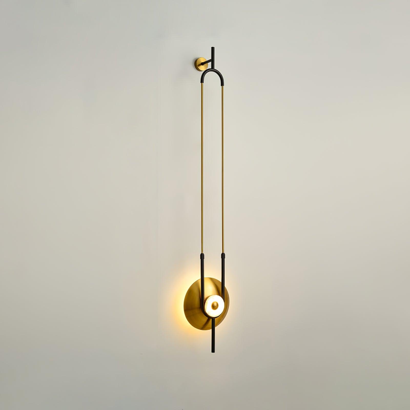 Oblique full wall-light view showing projecting black top support, round gold mount and glowing white ring