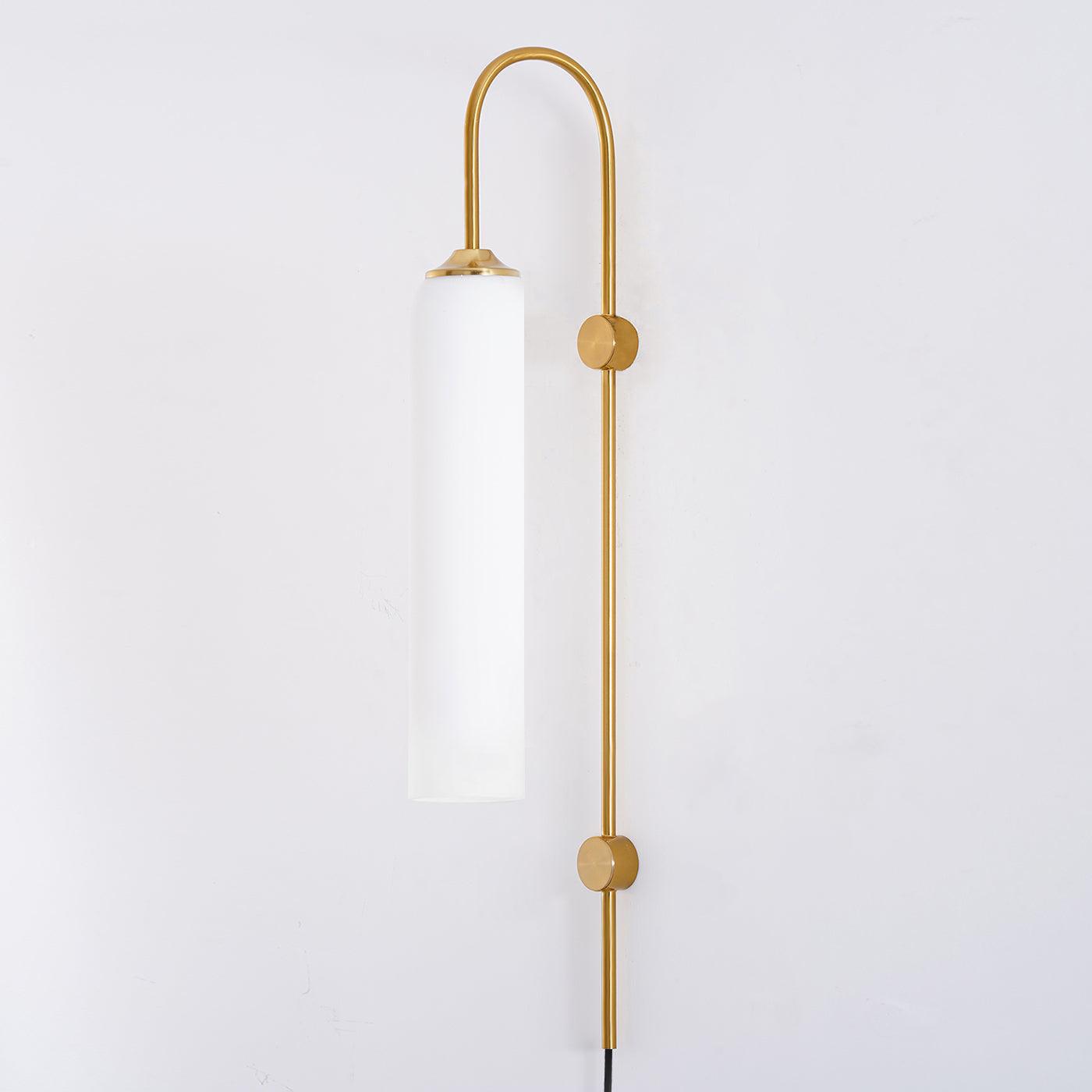 White cylindrical shade on a tall Gold body