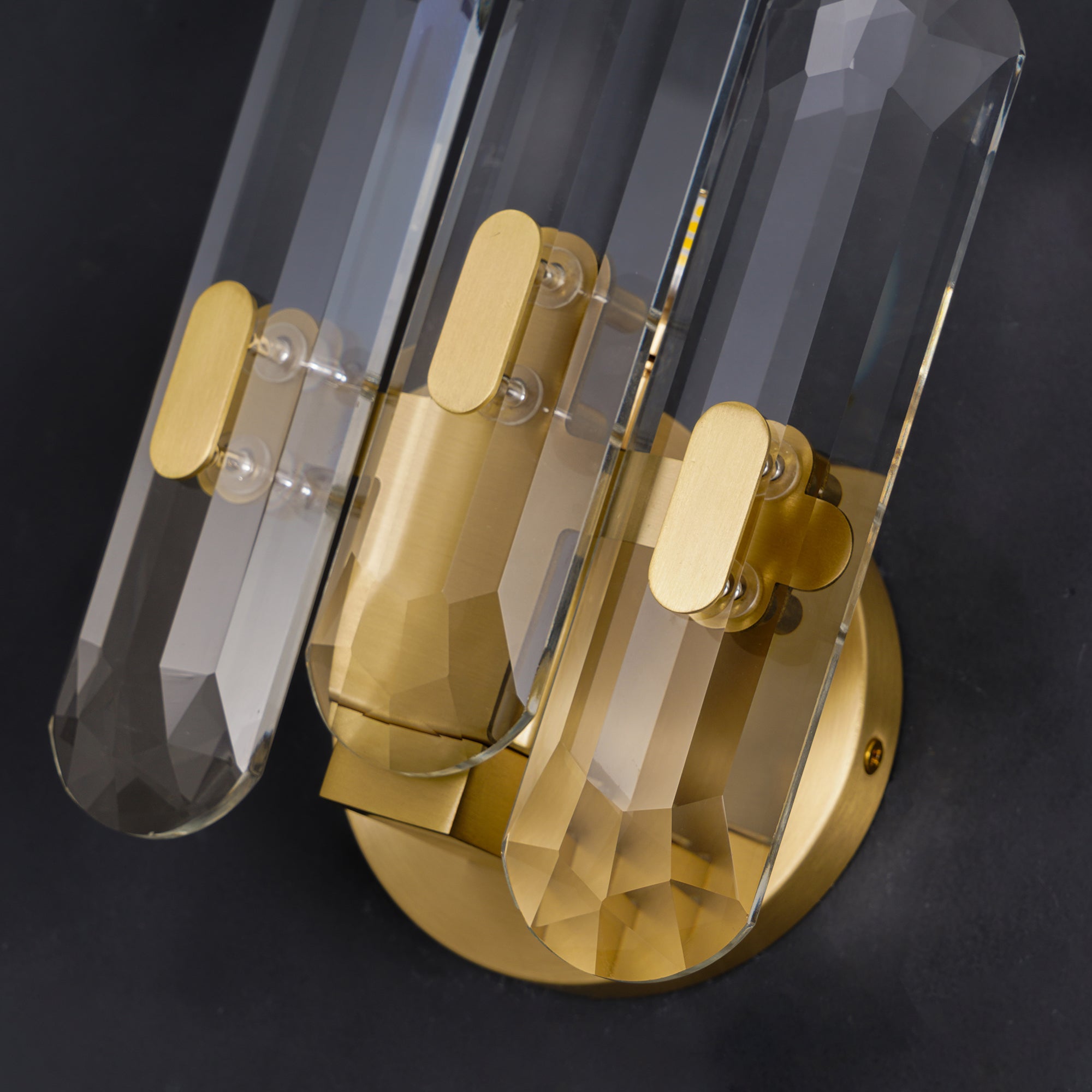 Angled detail of crystal prisms and holder