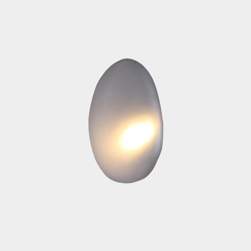 Smoky gray Model A Bubble Glass wall light with an illuminated oval glass shade