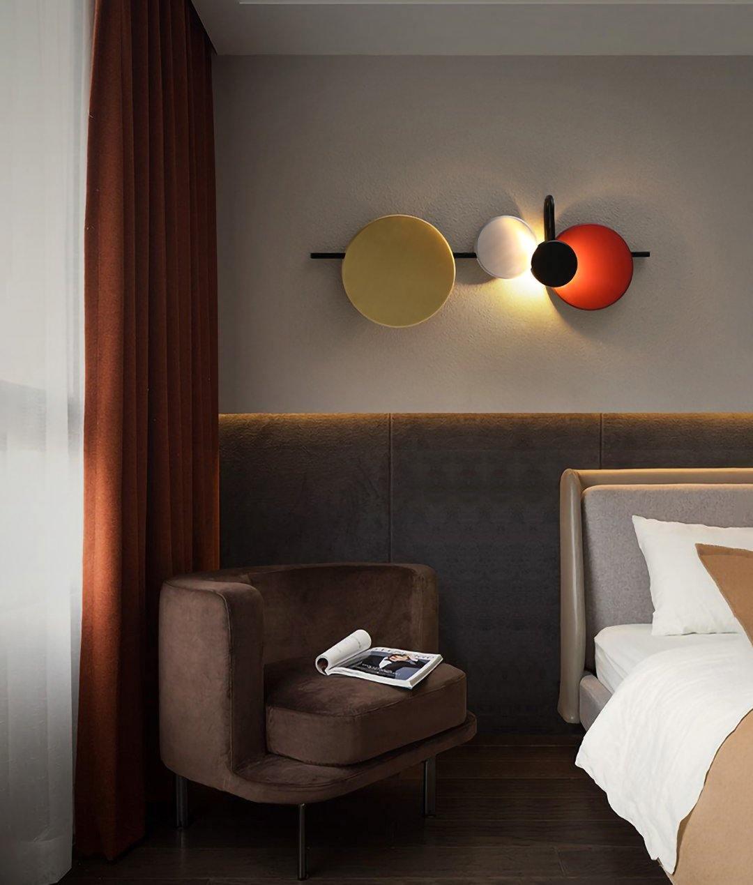 Disc fixture pictured horizontally beside a bed