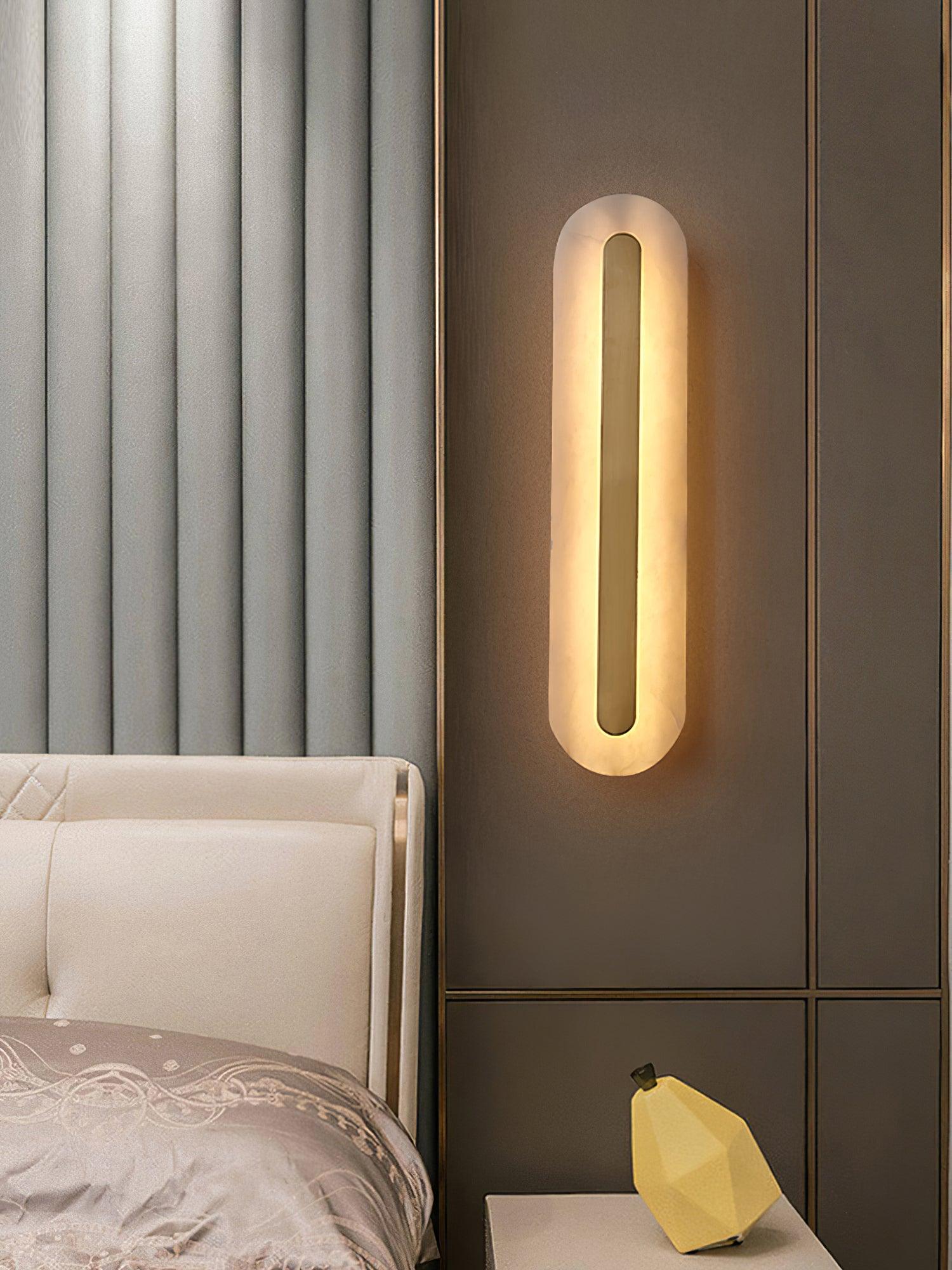 Warm-lit rounded panel beside a bed