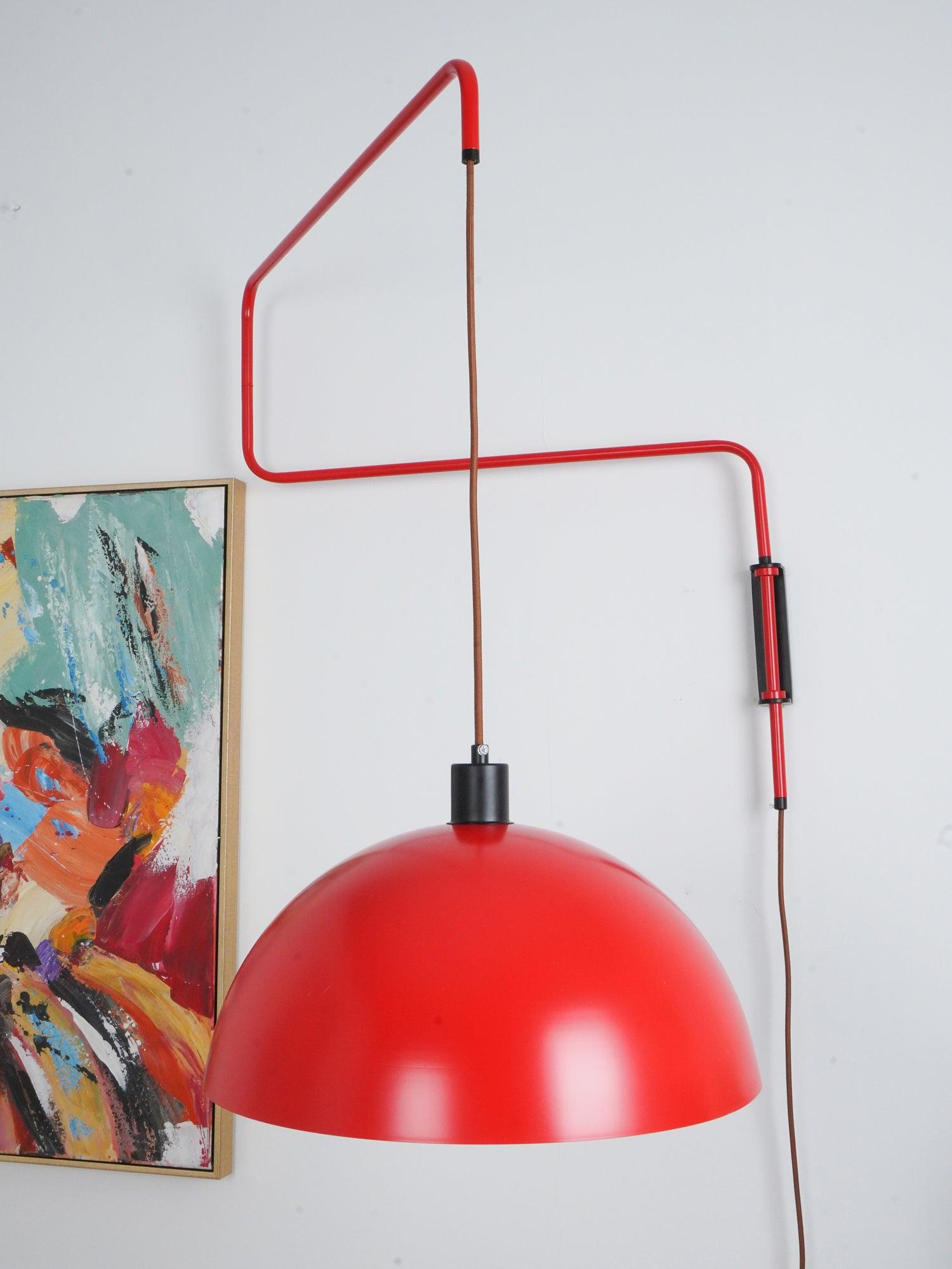 Close room view of red dome beside abstract artwork