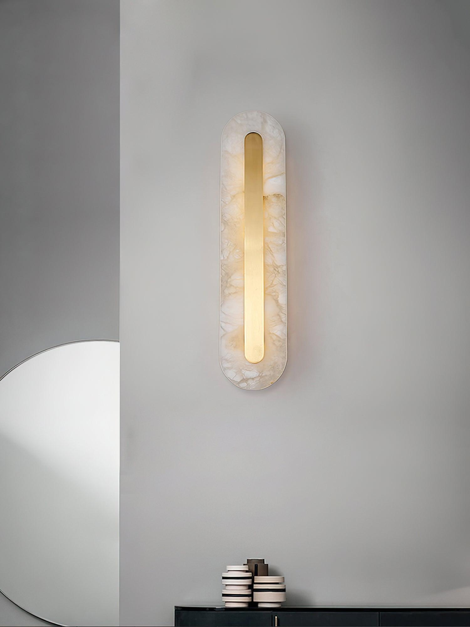 Small rounded wall light above a cabinet