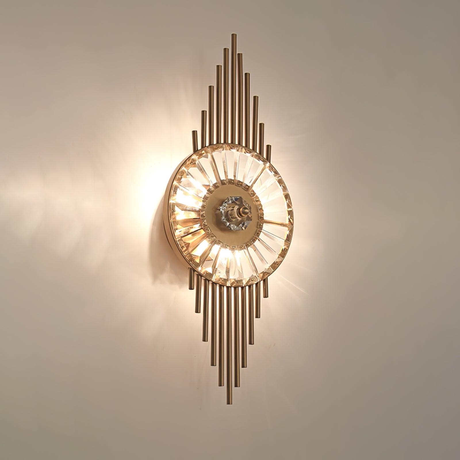 Angled front view of the lit radial glass circle with gold rods extending above and below