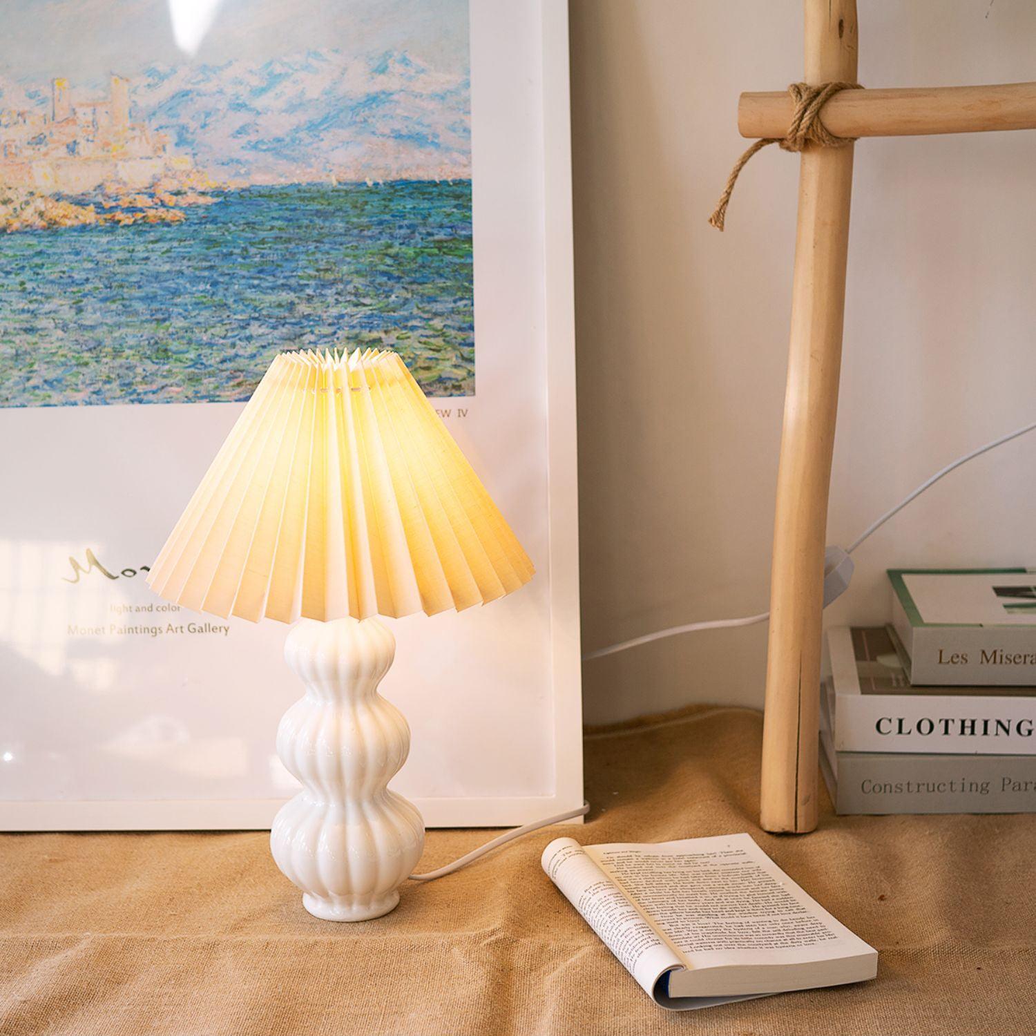 Leo lamp glowing on a wooden surface beside an open book