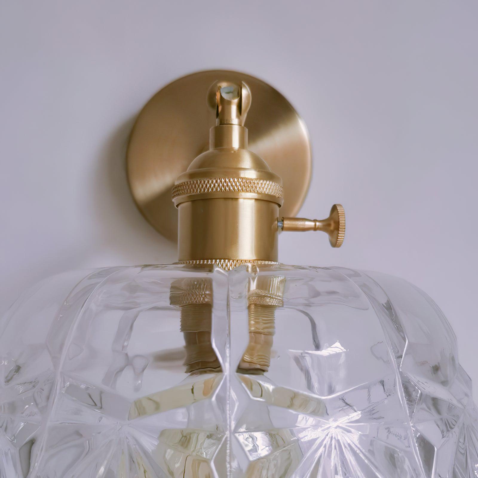 Close bulb-holder housing with textured rings and a side knob above the patterned transparent shade