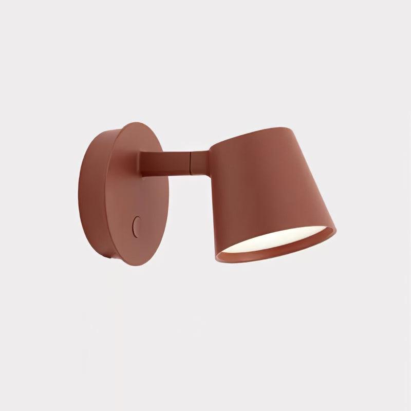 Red Tip fixture on pale square background, round plate at left and tapered head facing down to the right