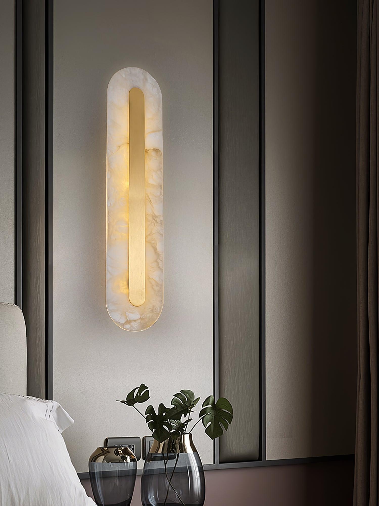 Rounded stone light beside a window