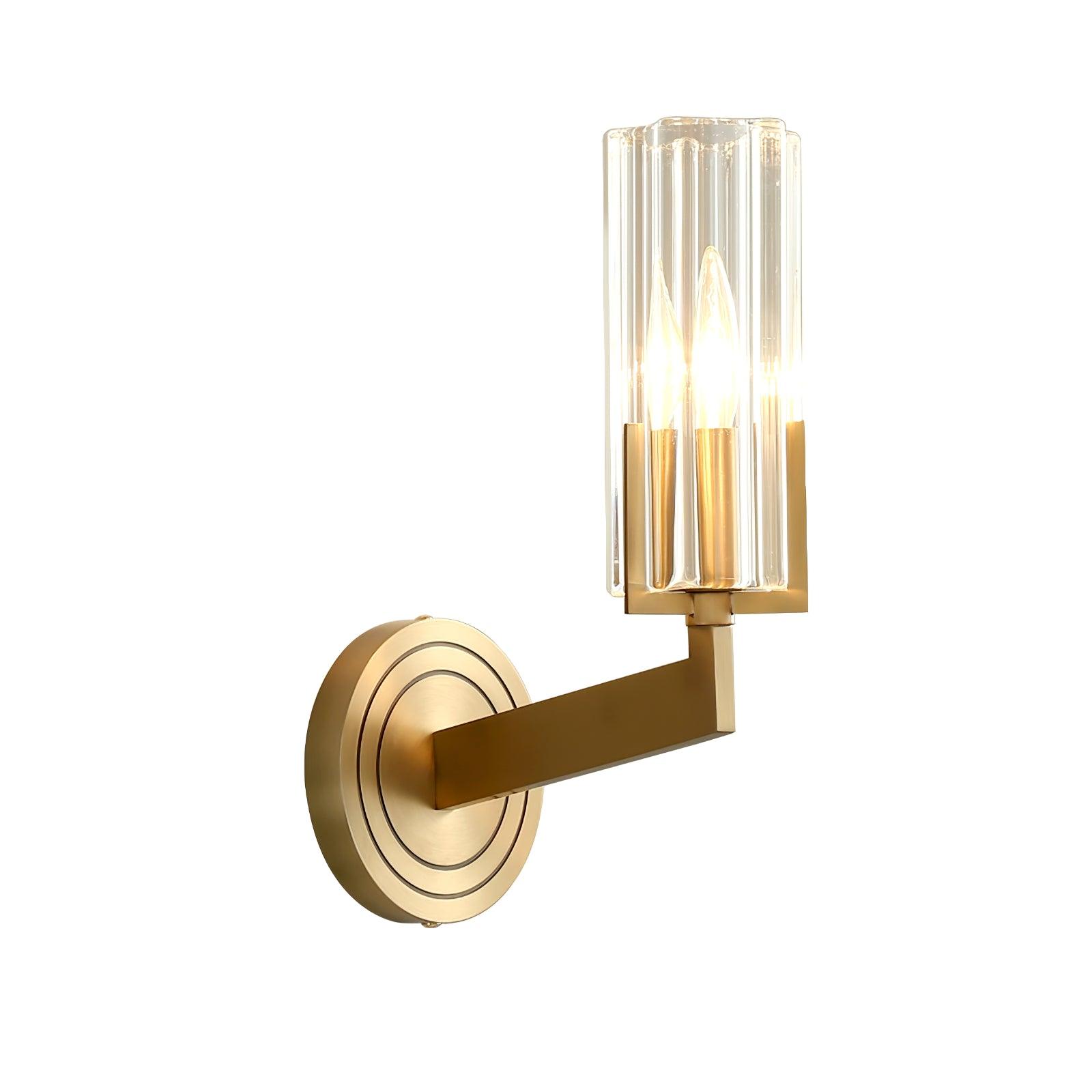 White-background single Kayla close-up with lit candle bulb inside clear fluted tube, angular brass arm and round plate at left