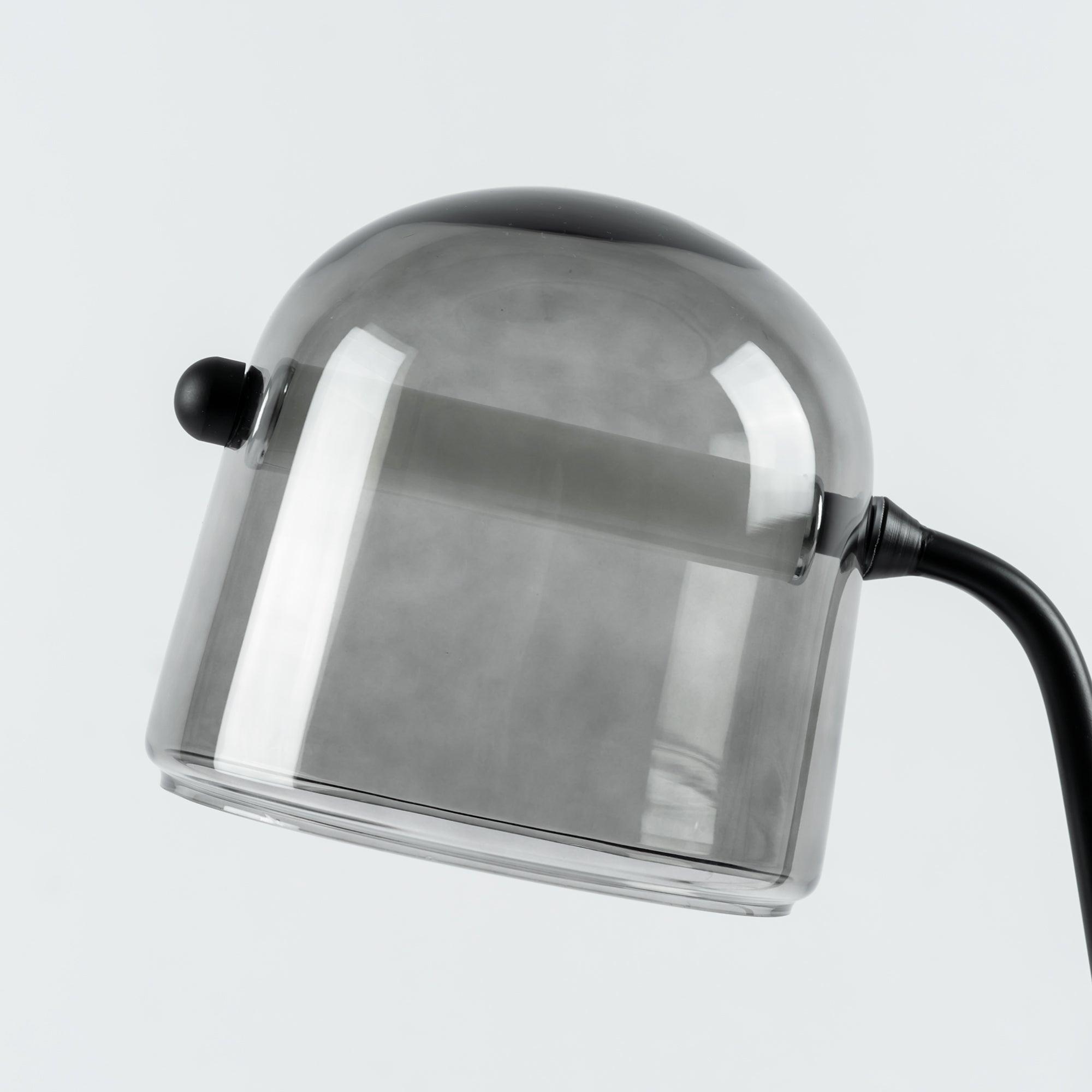 Angled close-up of Mona glass shade and tube connection