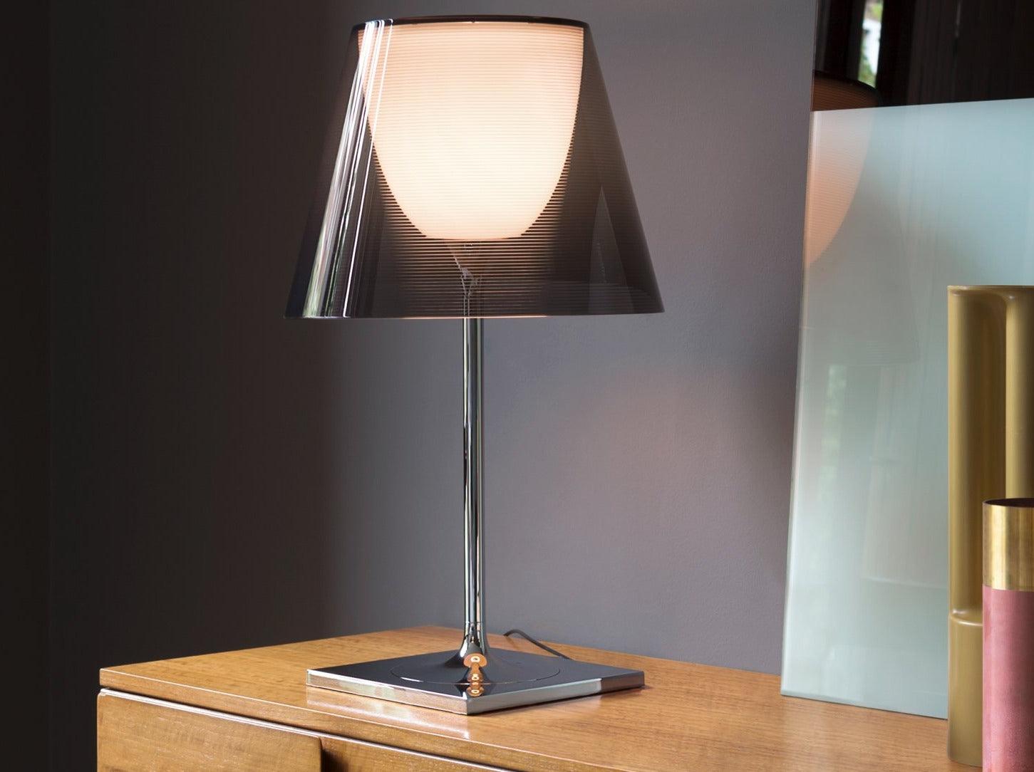 Dark translucent Chrome Prism shade on a wooden cabinet