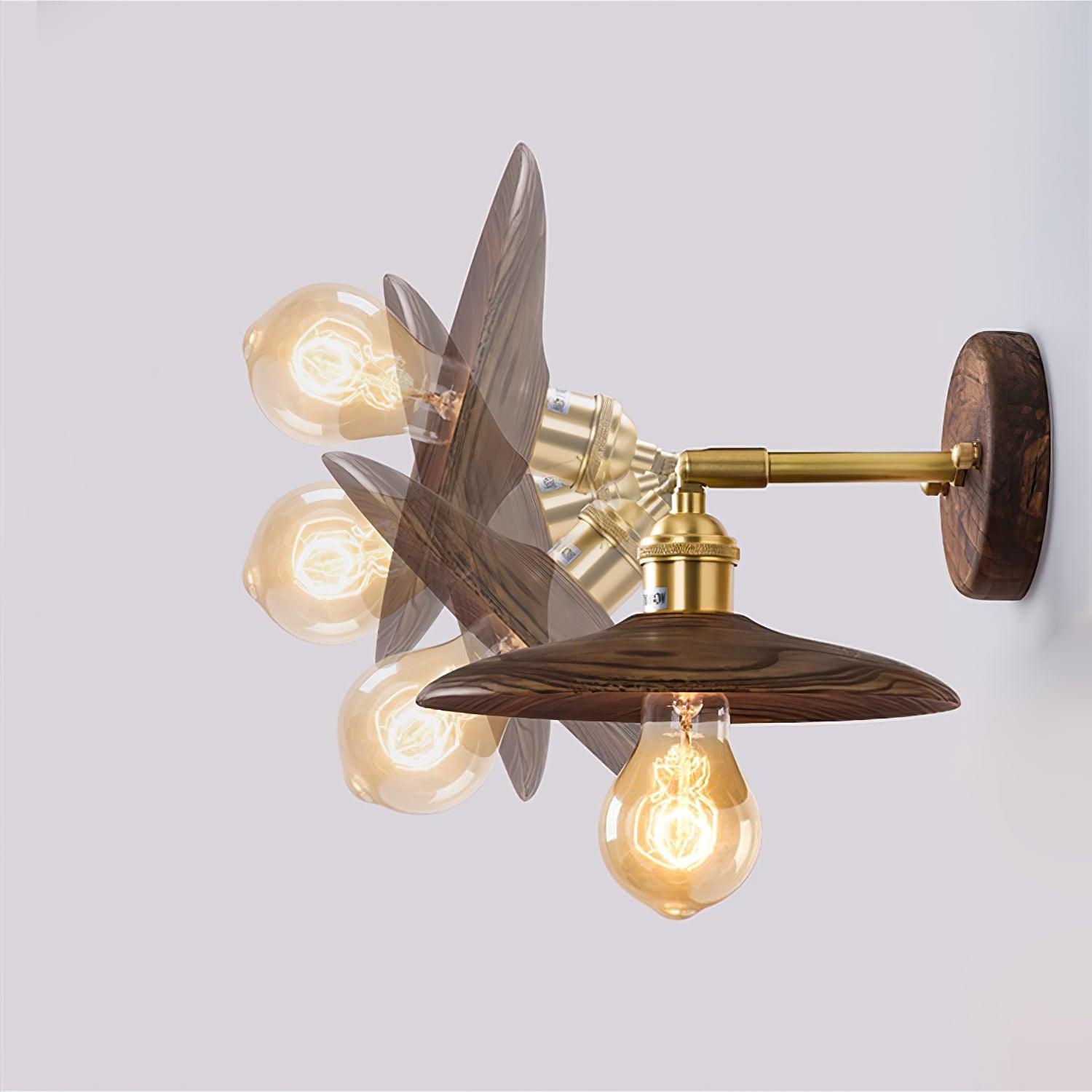 Graphic showing flared wood shade and bulb in several tilted head positions on a short brass arm and round wood plate