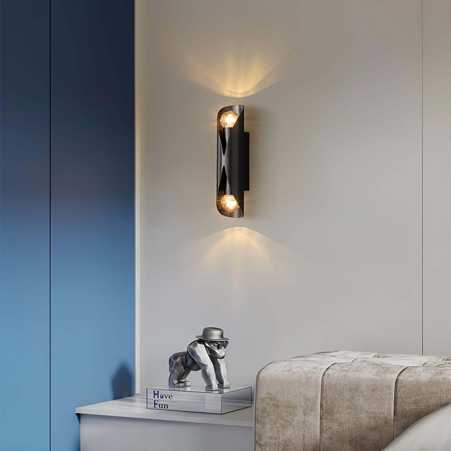 Black dual-ended wall light on a blue wall