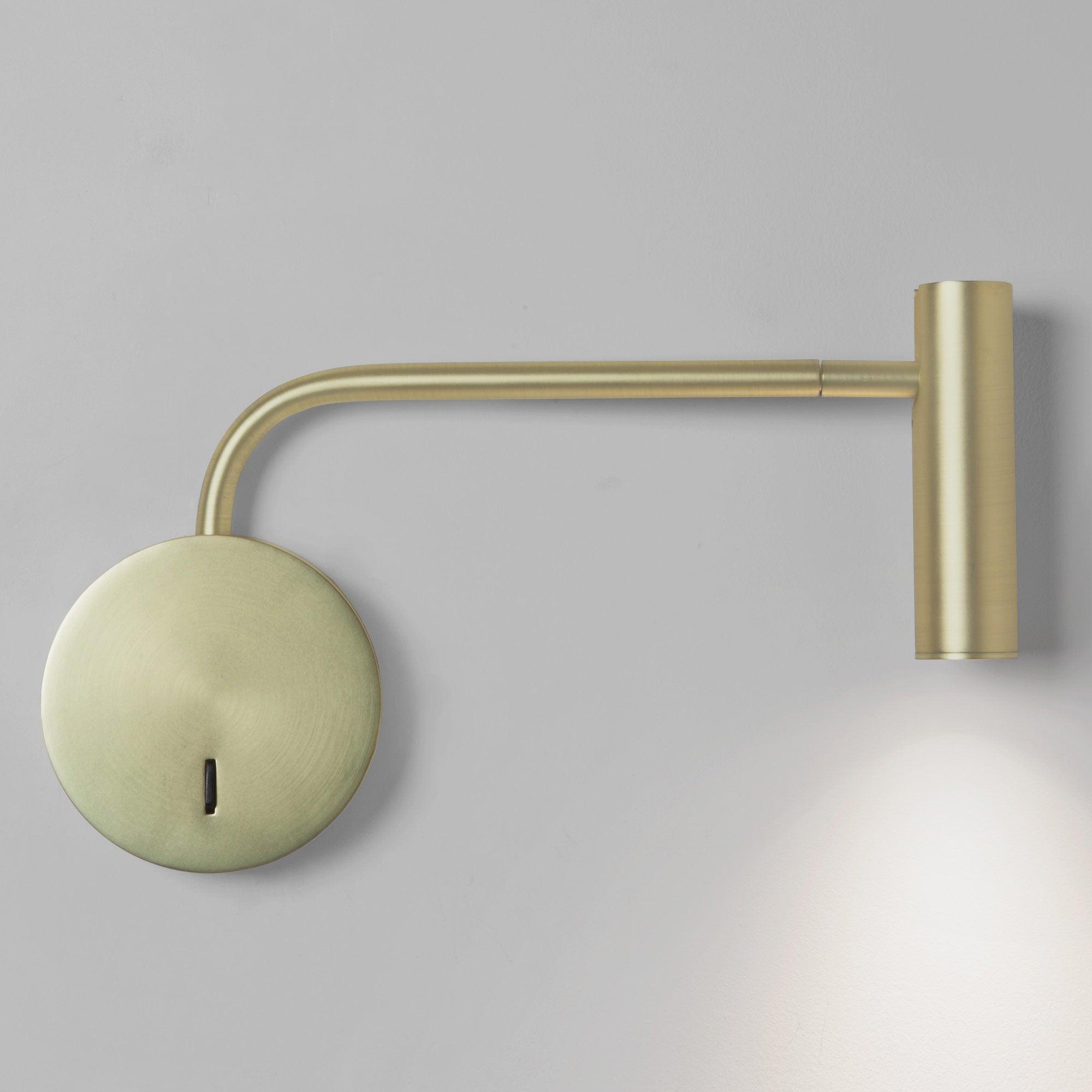 Gold-coloured L-shaped arm and cylindrical head