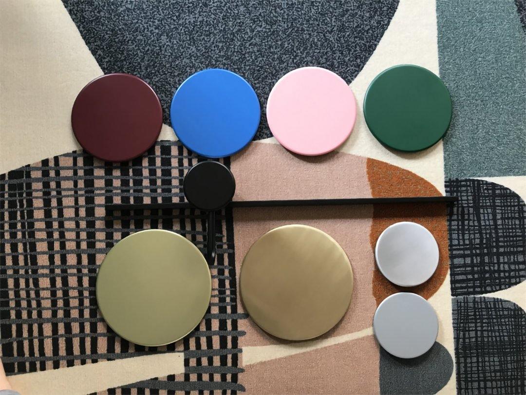 Loose coloured and reflective circular components displayed
