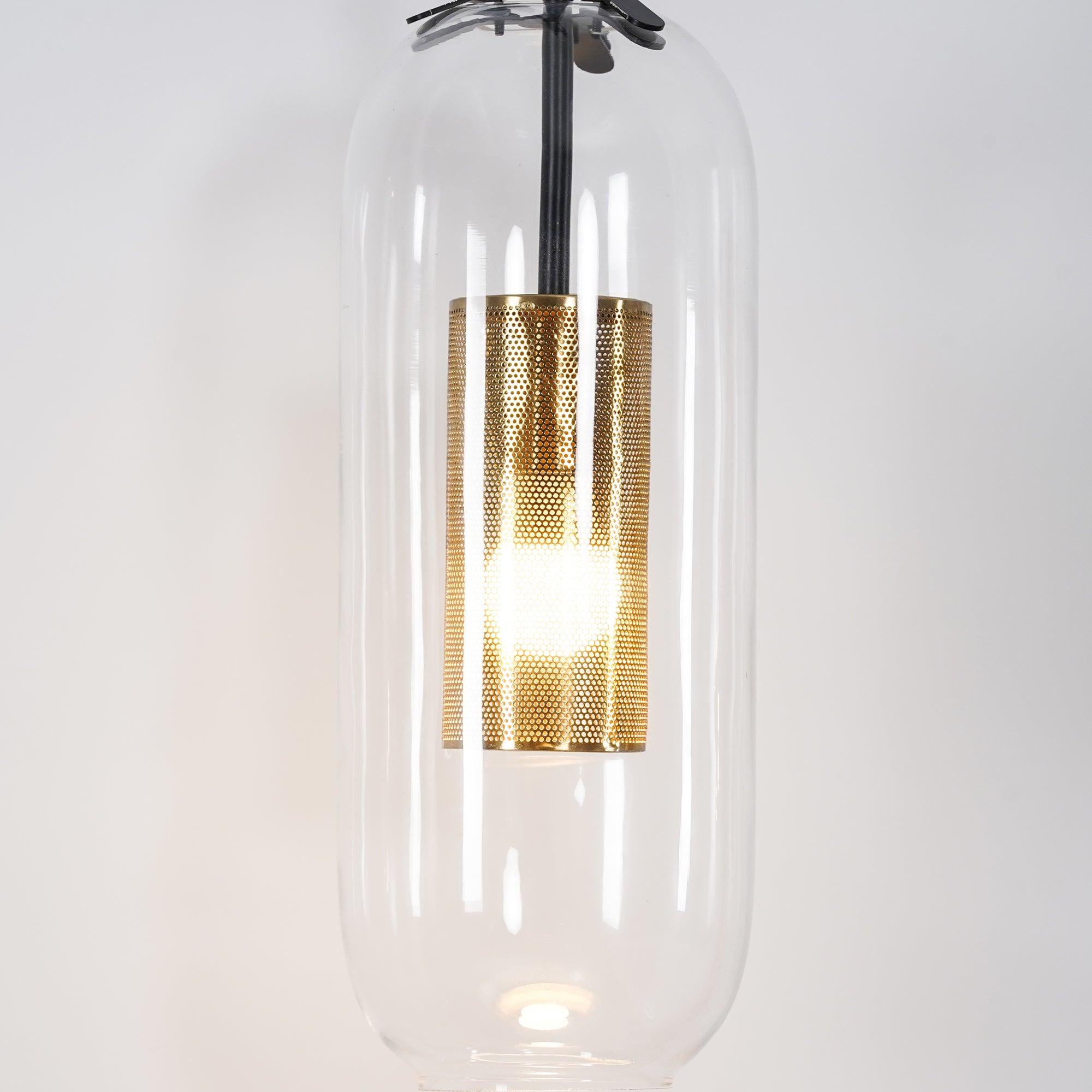 Glowing bulb behind a perforated metal cylinder