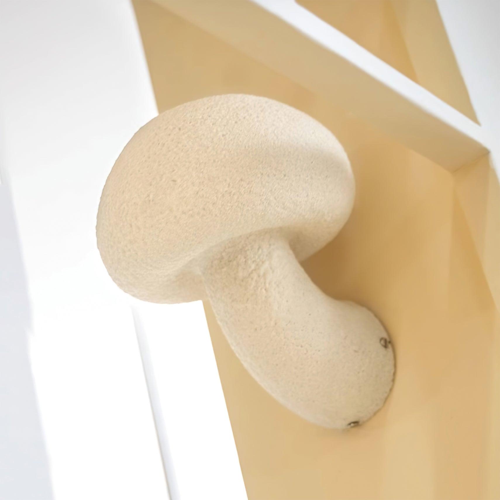 Angled view of mushroom-shaped wall light