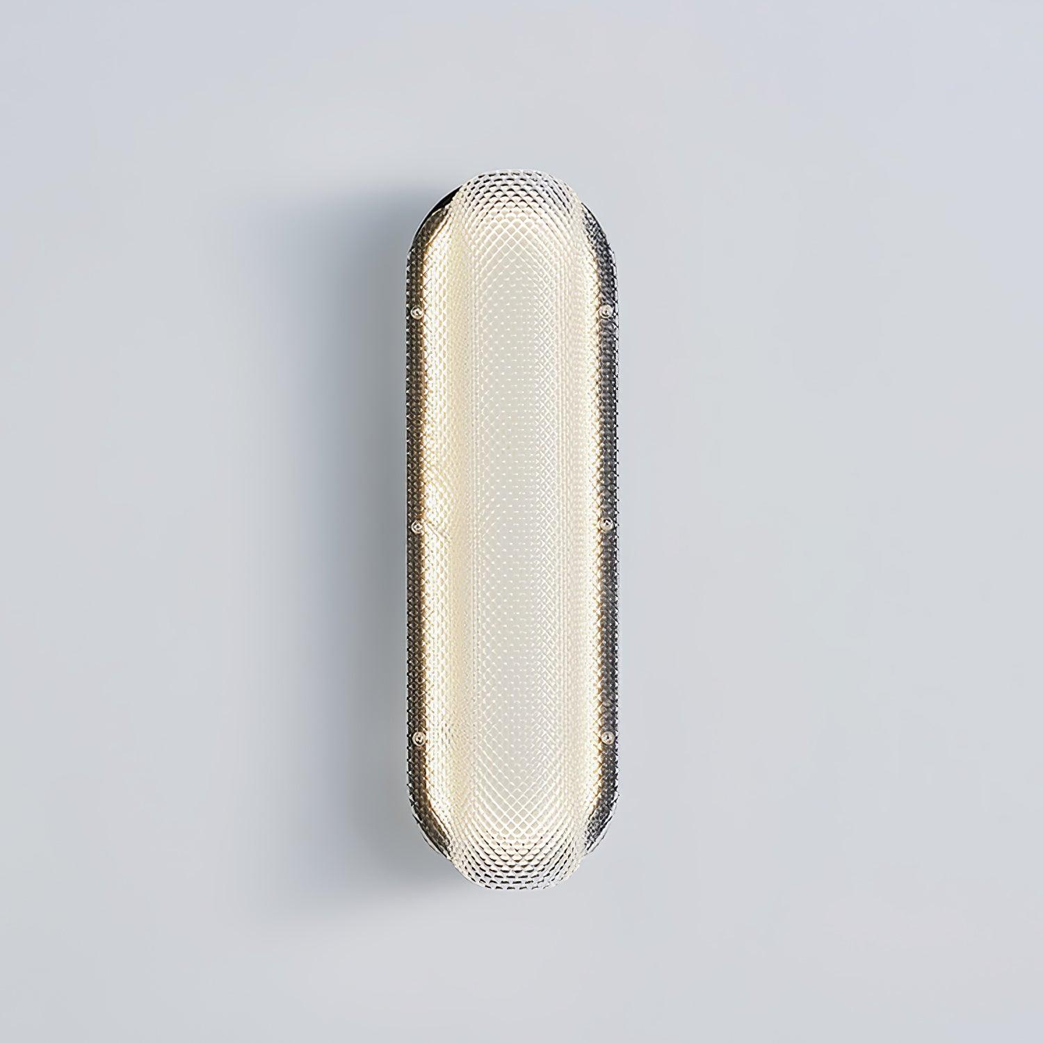 Close front view of the lit diamond-textured glass lens, black backing and side fixings