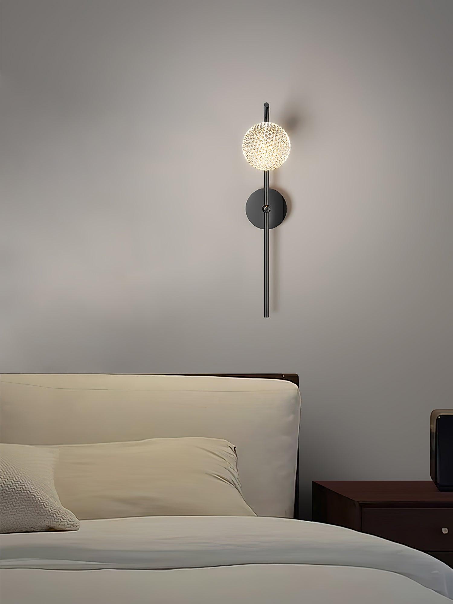 Textured round head on a slim Black bedside wall lamp