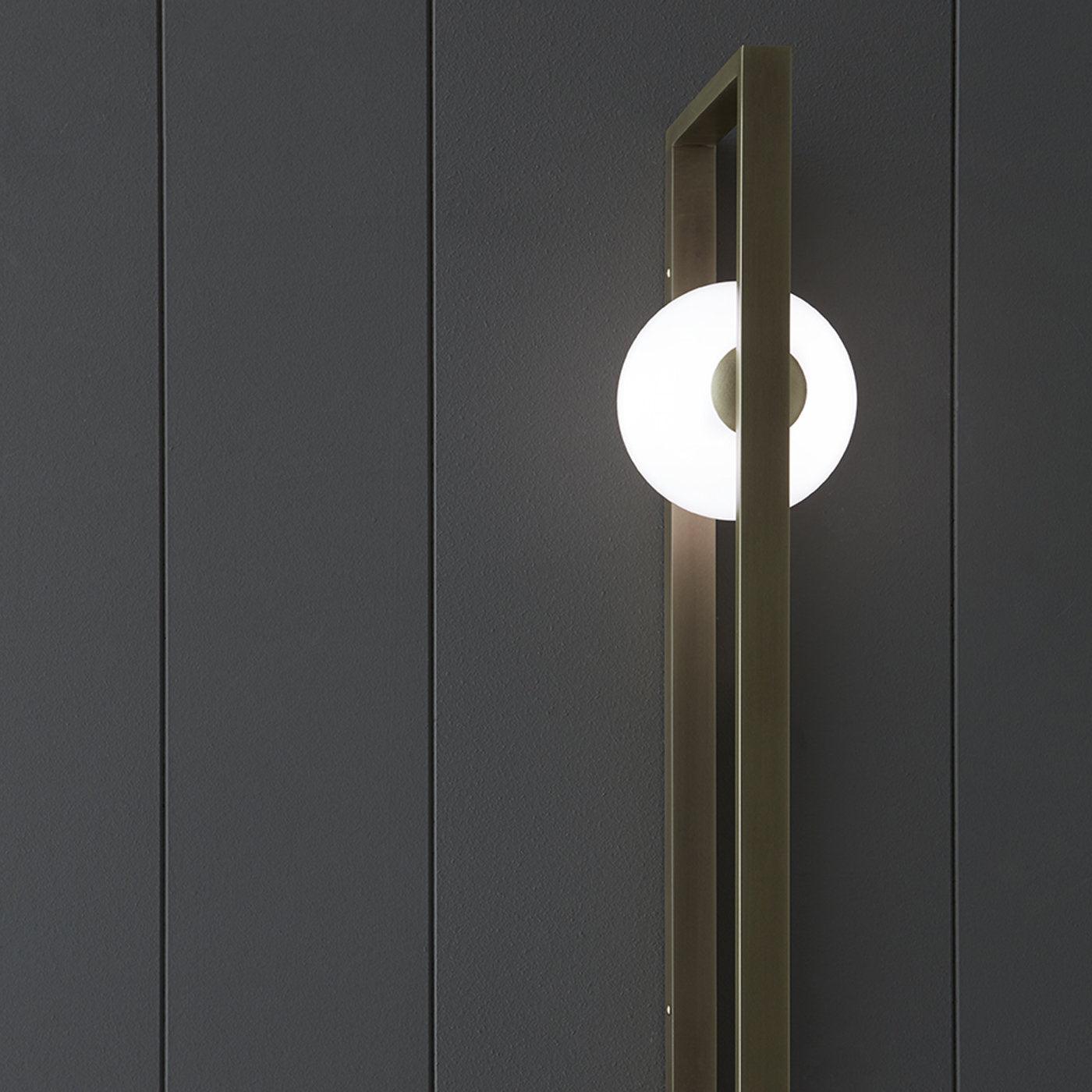 Vertical arrangement of Mondrian frame and lit globe