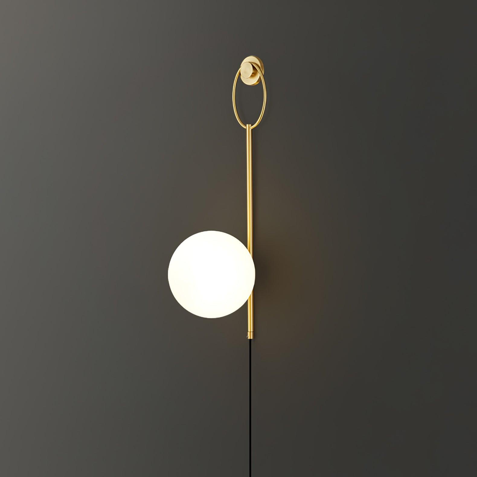 Ballon globe lamp illuminated against a dark wall