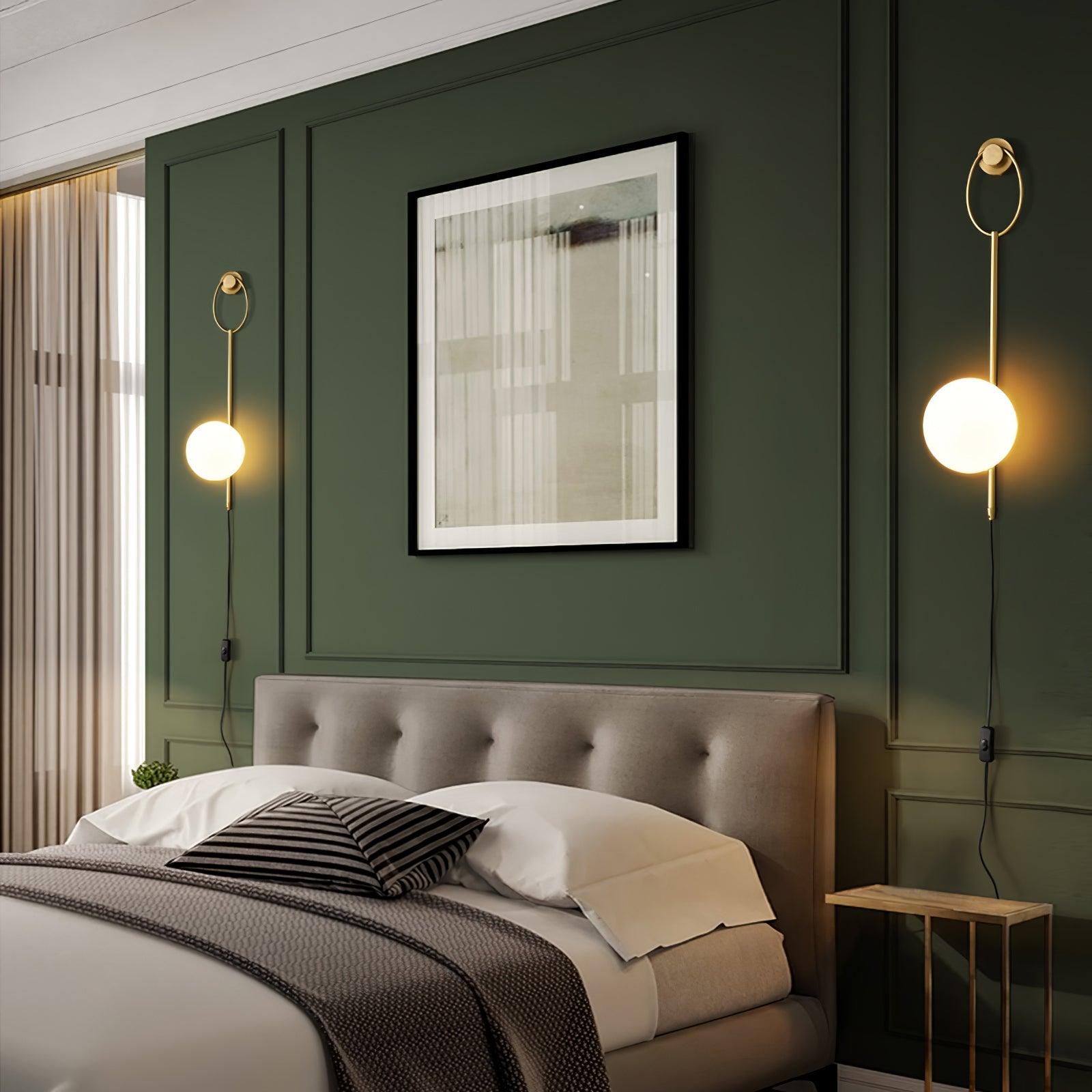 Two Ballon wall lamps flanking a bedroom headboard