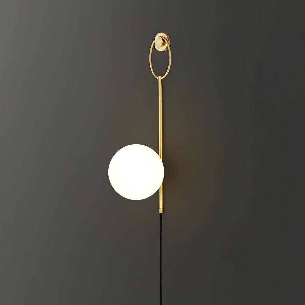 White globe and gold-toned ring-stem wall fixture