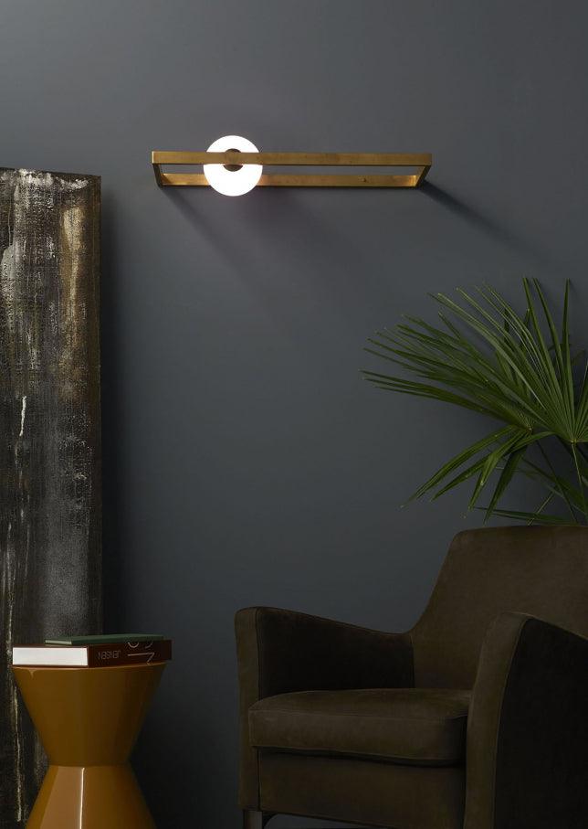 Mondrian wall light above an indoor seating corner
