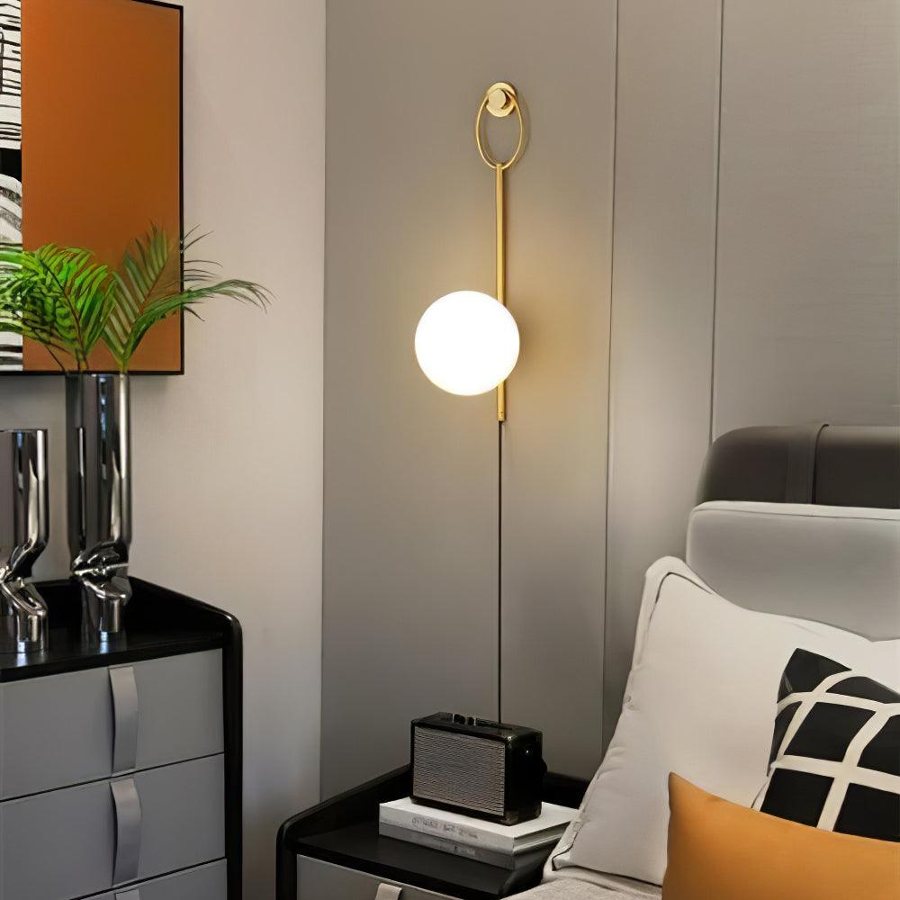 Ballon wall lamp above a seating-area side table