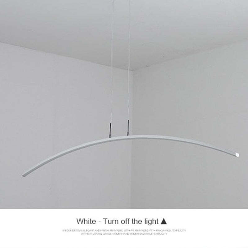 White Edge pendant shown switched off, with its arched bar and suspension cables.