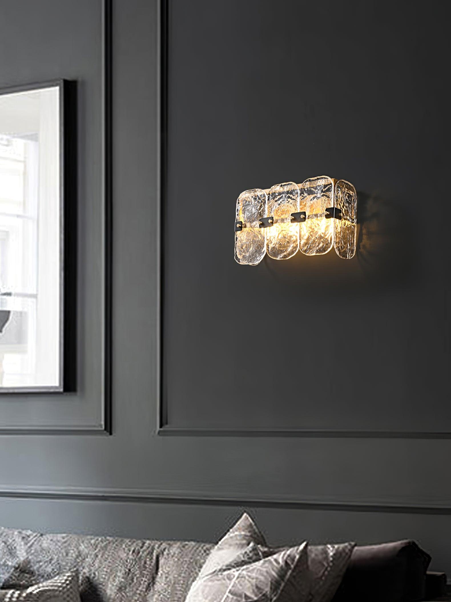 Massive wall sconce beside a window and sofa