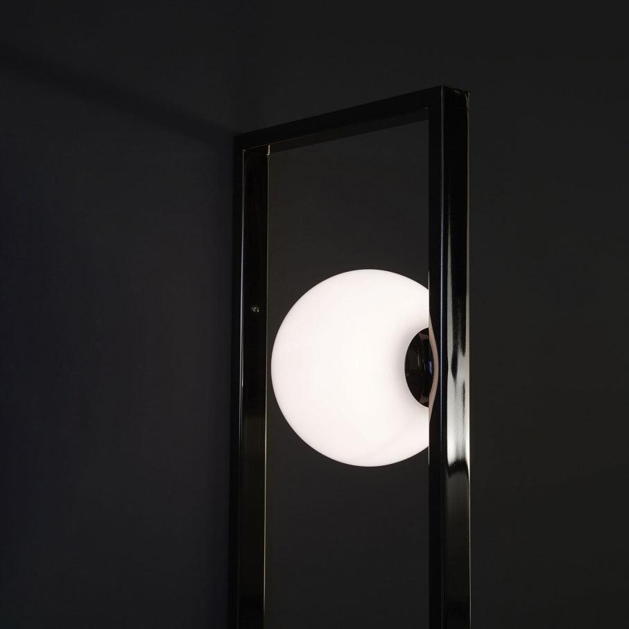 Angled view of White globe inside the Black frame