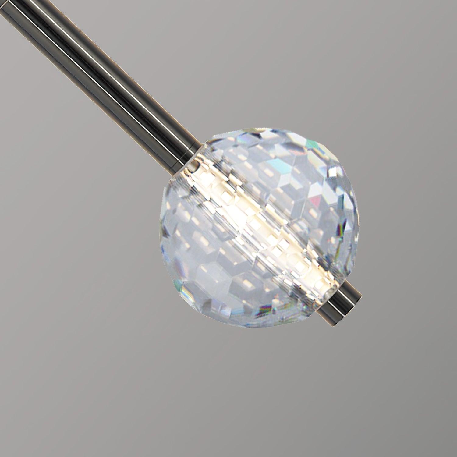 Diagonal close-up of clear faceted globe with luminous centre and rainbow reflections, dark neck and short lower cap