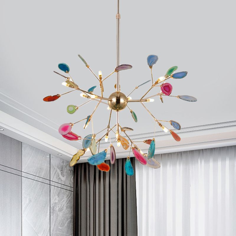 Large multicolour stone-leaf pendant with a central gold-tone sphere and branching arms near curtains