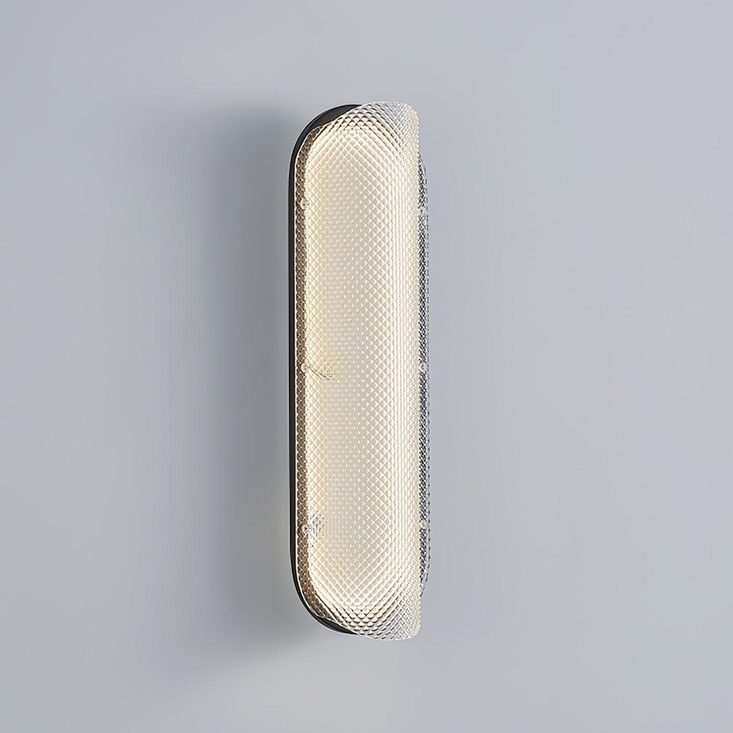 Angled close view of the curved textured glass lens projecting from the black backing