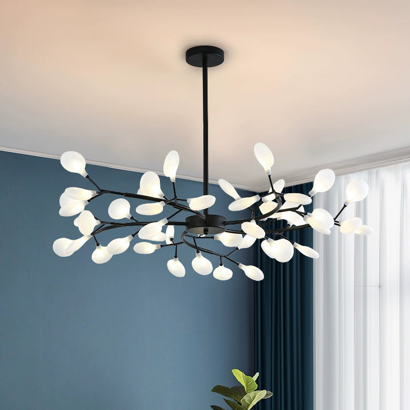 Olivia black branch chandelier with white oval shades in a room
