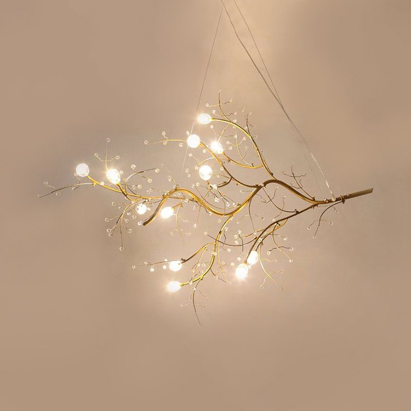 Illuminated Olivia gold-tone branches and clear ornaments