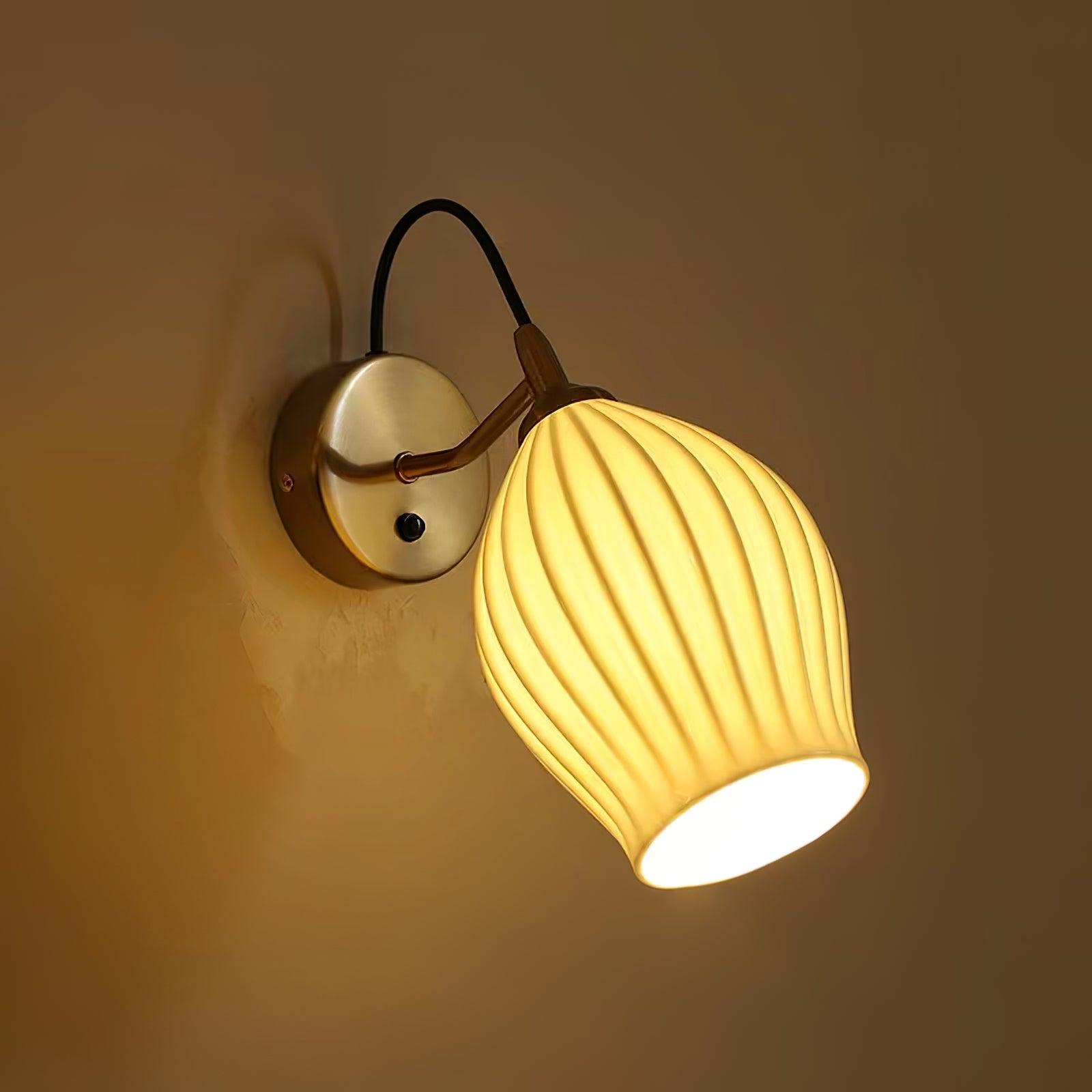 Warm glow through the ribbed ceramic wall shade