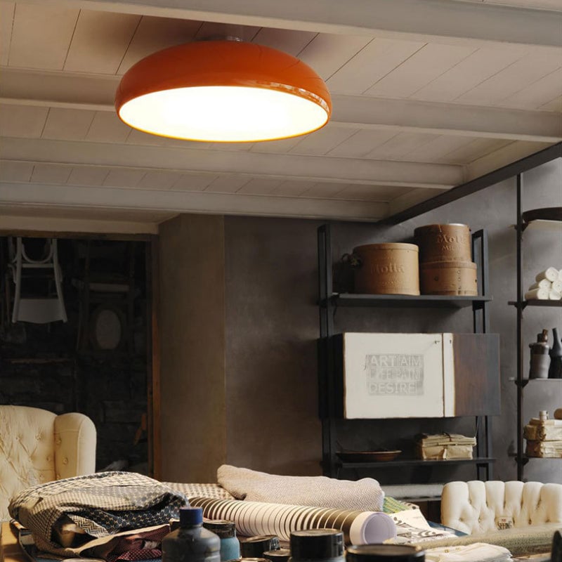 Illuminated orange Morandi dome light in a rustic living room