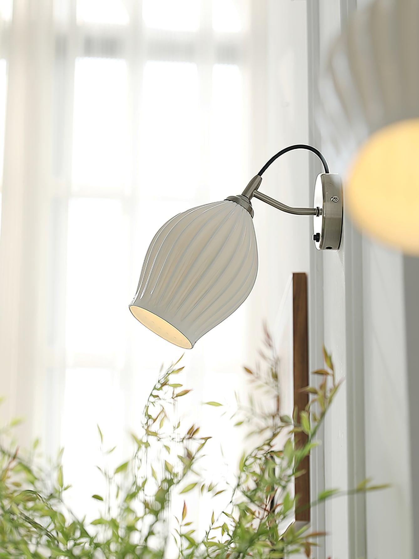 Ceramic wall light beside a bright window