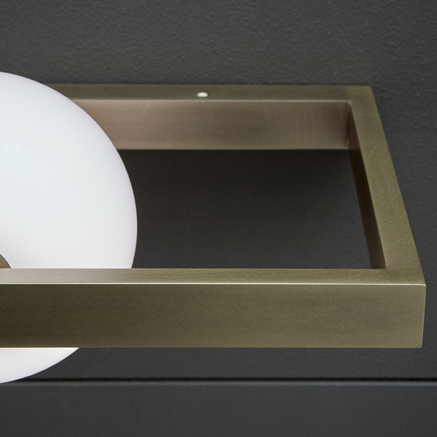 Close view of brushed frame corner and White globe