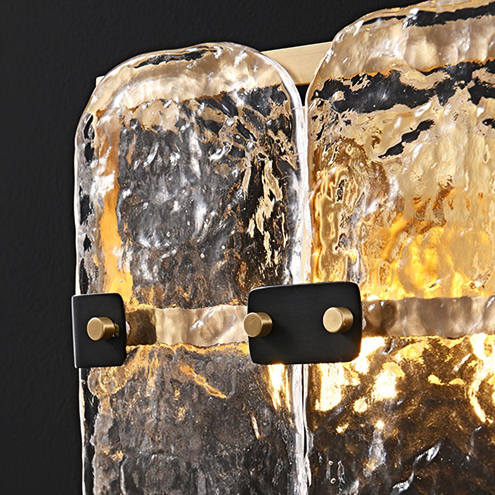 Close view of uneven clear glass and dark fastening tabs