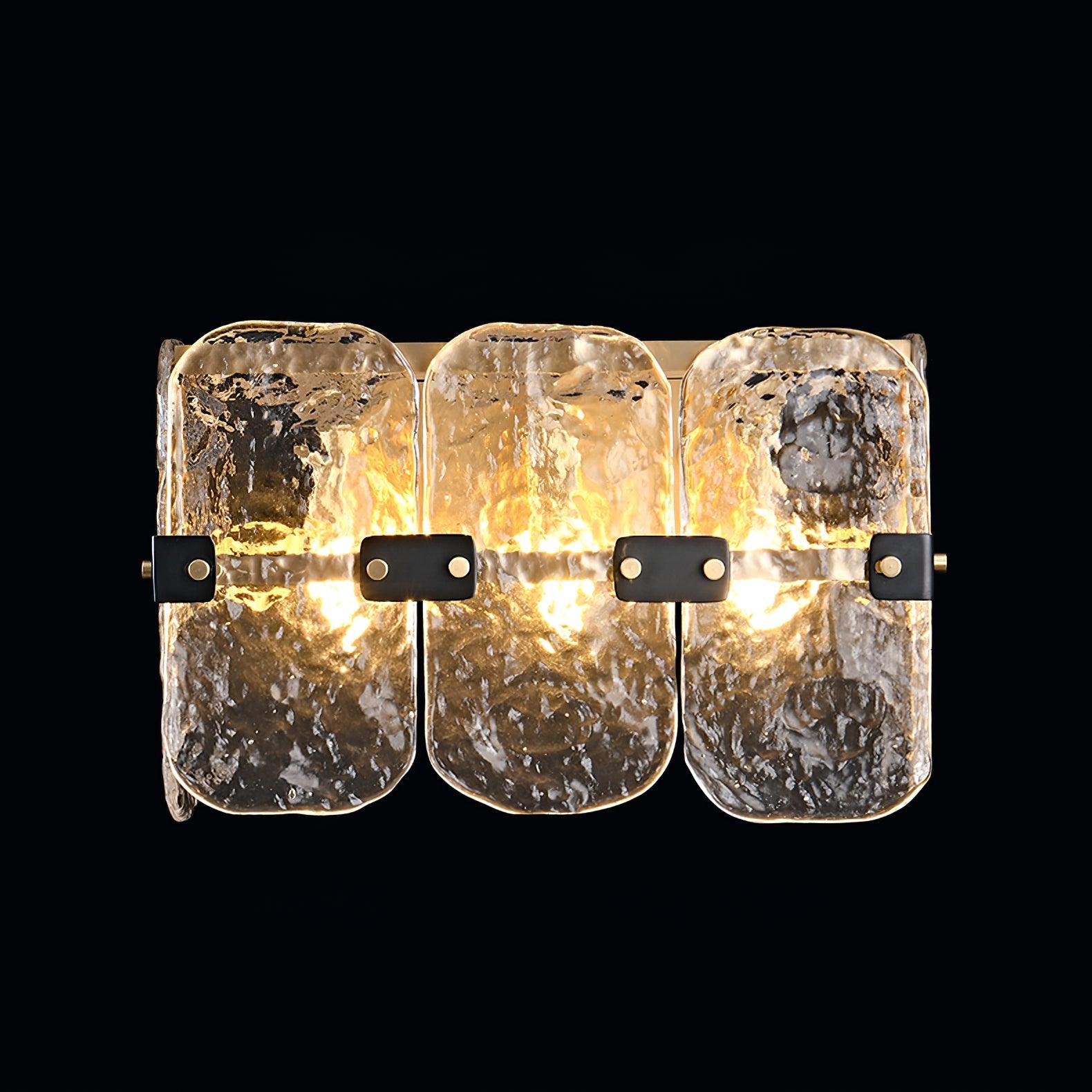 Lit Massive sconce shining through textured clear glass